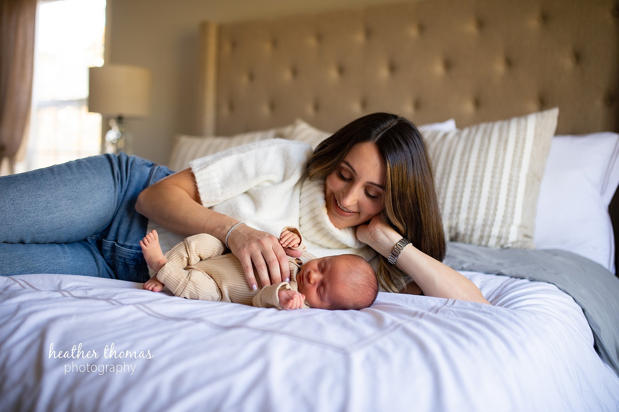 philadelphia-newborn-photogrpaher-heather-thomas-photography--02 a family holding a newborn boy during an in home lifestyle newborn photo session with heather thomas photography