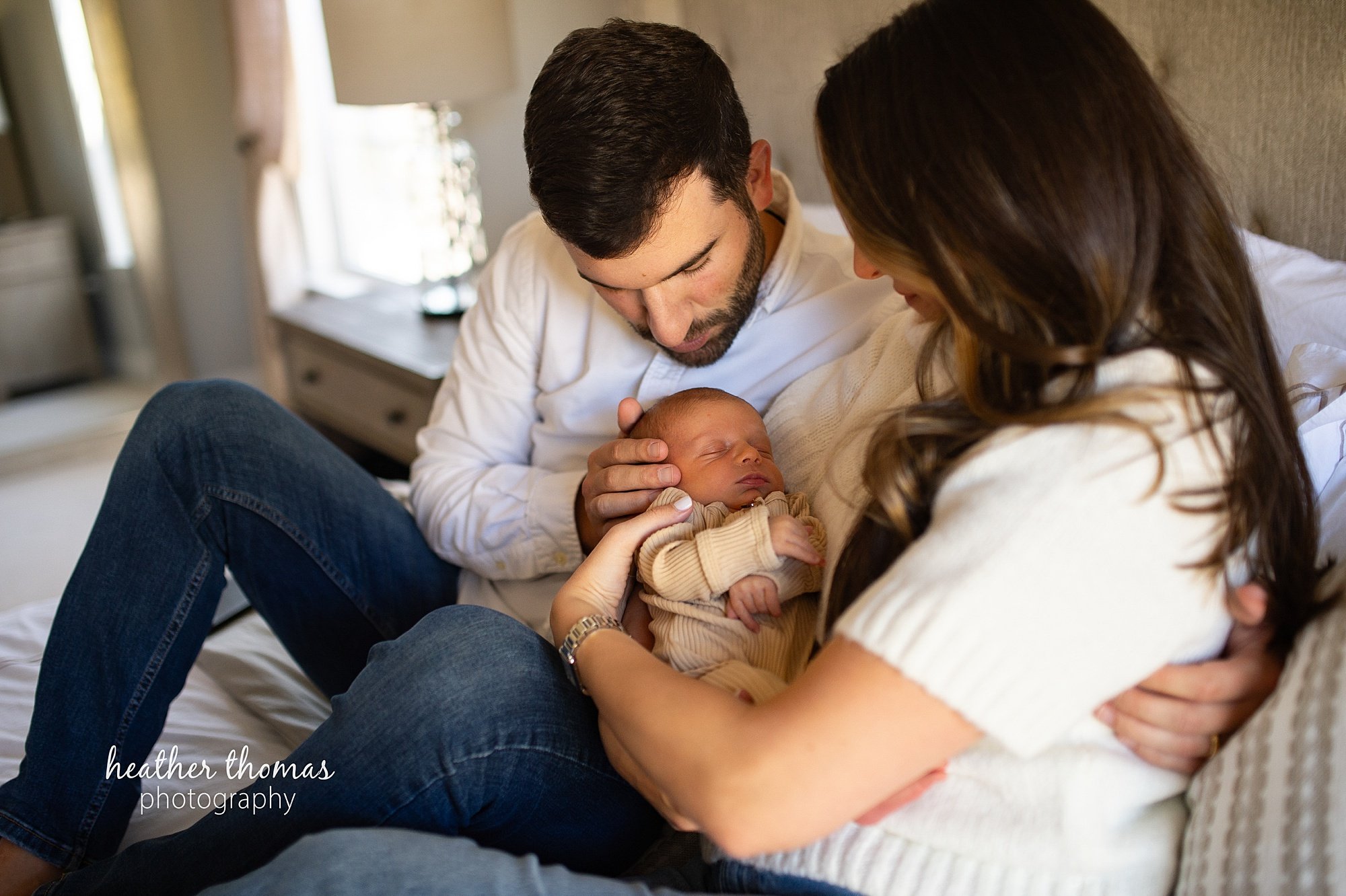 philadelphia-newborn-photogrpaher-heather-thomas-photography--02 a family holding a newborn boy during an in home lifestyle newborn photo session with heather thomas photography