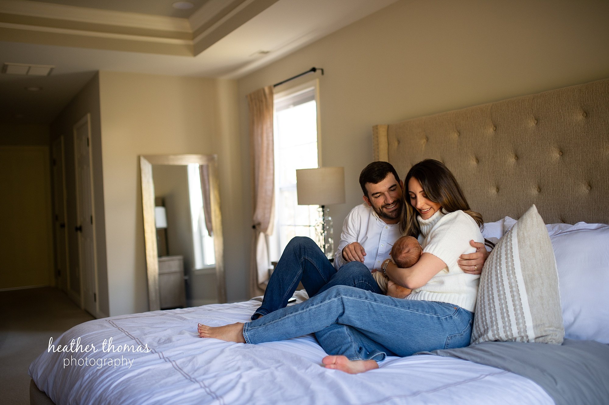 philadelphia-newborn-photogrpaher-heather-thomas-photography--02 a family holding a newborn boy during an in home lifestyle newborn photo session with heather thomas photography