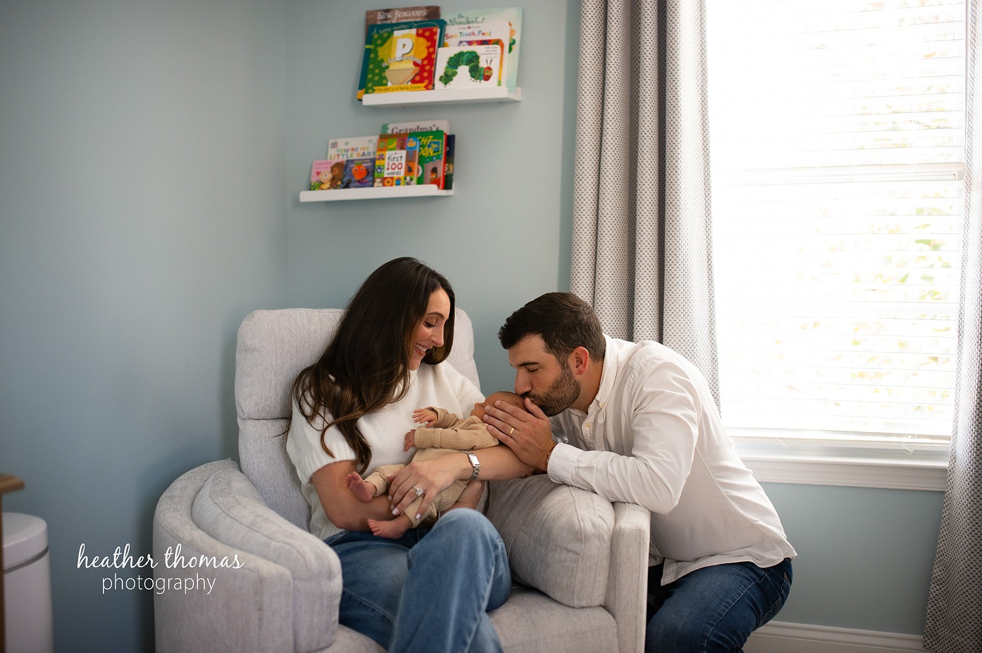 philadelphia-newborn-photogrpaher-heather-thomas-photography--02 a family holding a newborn boy during an in home lifestyle newborn photo session with heather thomas photography