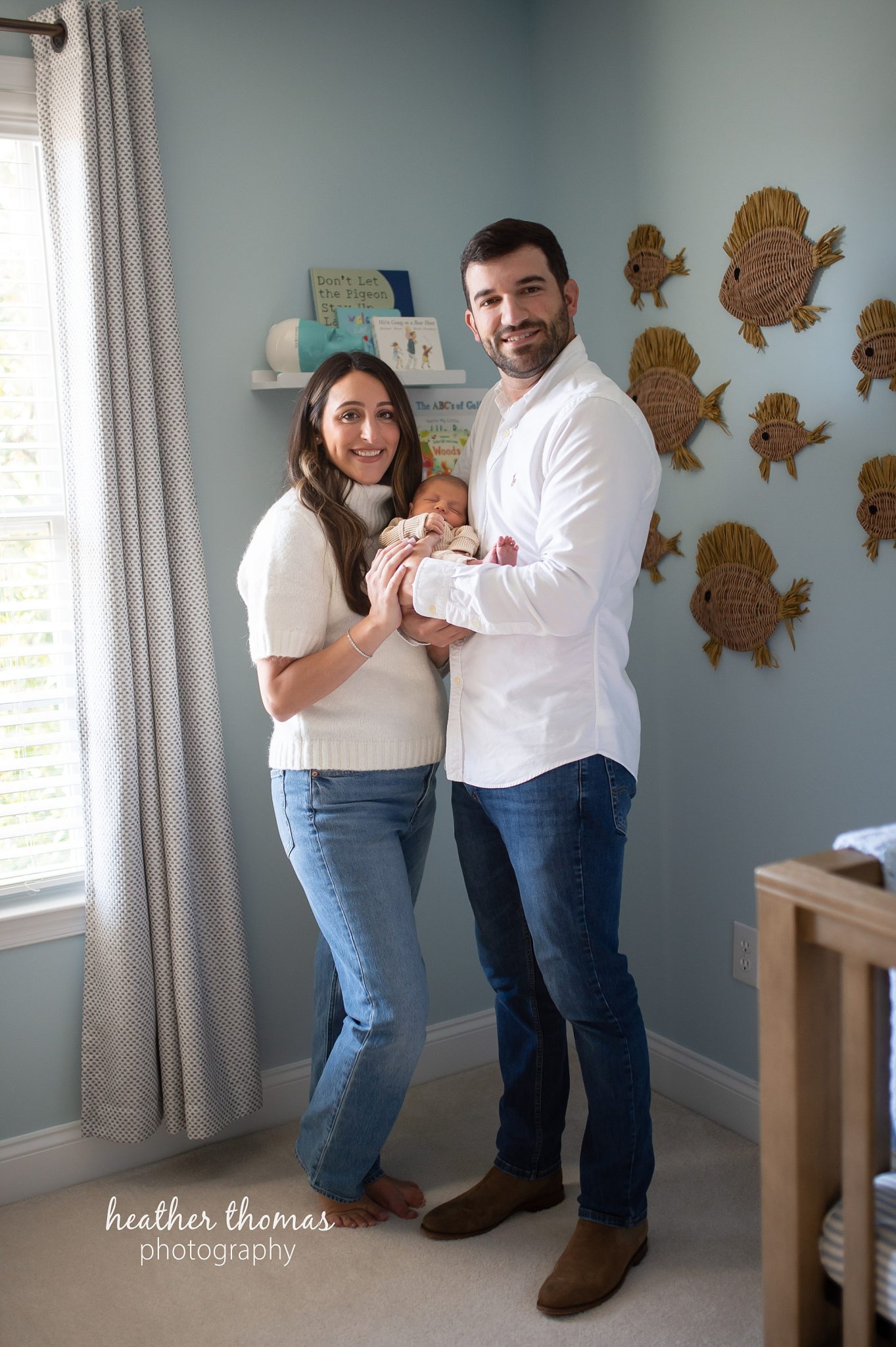 philadelphia-newborn-photogrpaher-heather-thomas-photography--02 a family holding a newborn boy during an in home lifestyle newborn photo session with heather thomas photography
