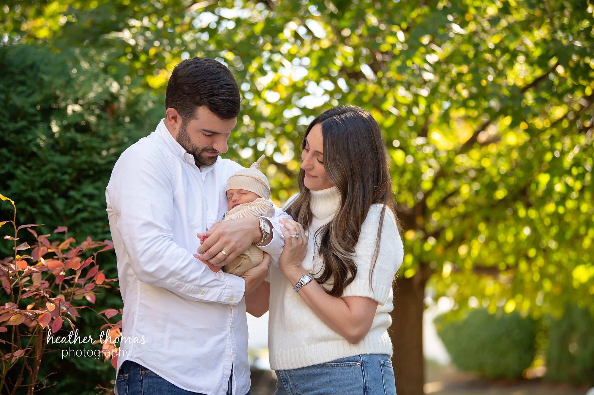 philadelphia-newborn-photogrpaher-heather-thomas-photography--02 a family holding a newborn boy during an in home lifestyle newborn photo session with heather thomas photography