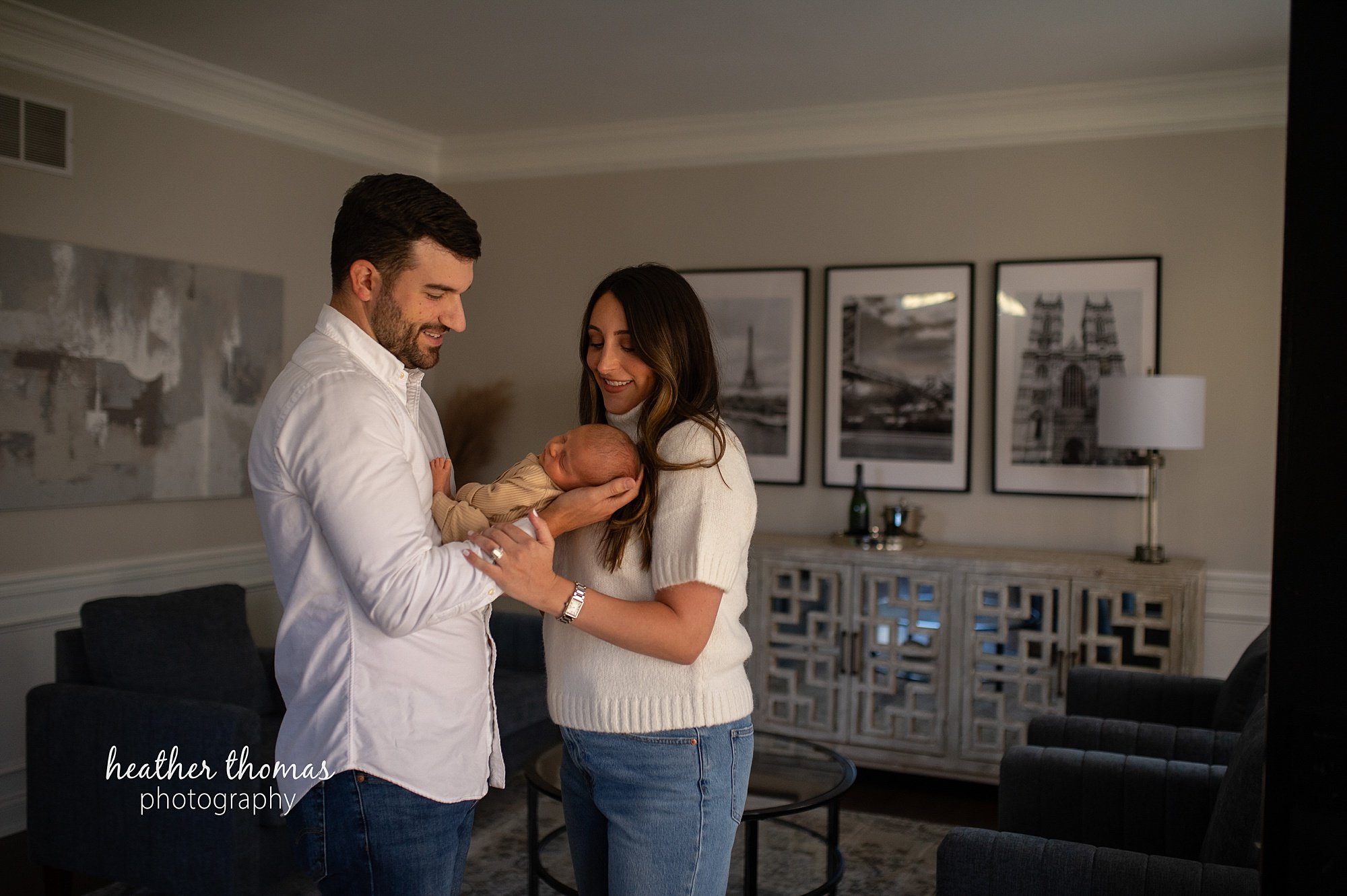 philadelphia-newborn-photogrpaher-heather-thomas-photography--02 a family holding a newborn boy during an in home lifestyle newborn photo session with heather thomas photography