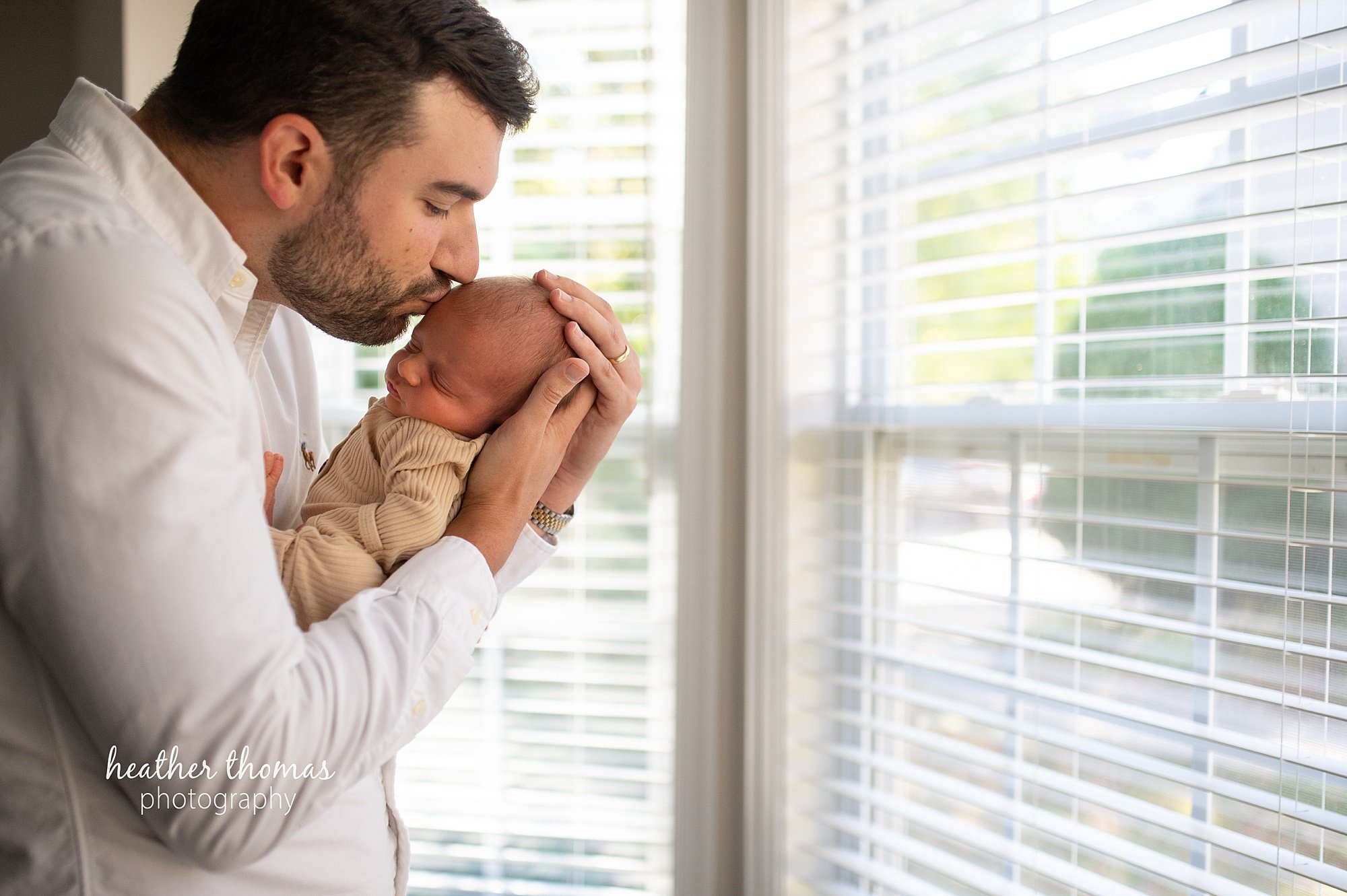 philadelphia-newborn-photogrpaher-heather-thomas-photography--02 a family holding a newborn boy during an in home lifestyle newborn photo session with heather thomas photography