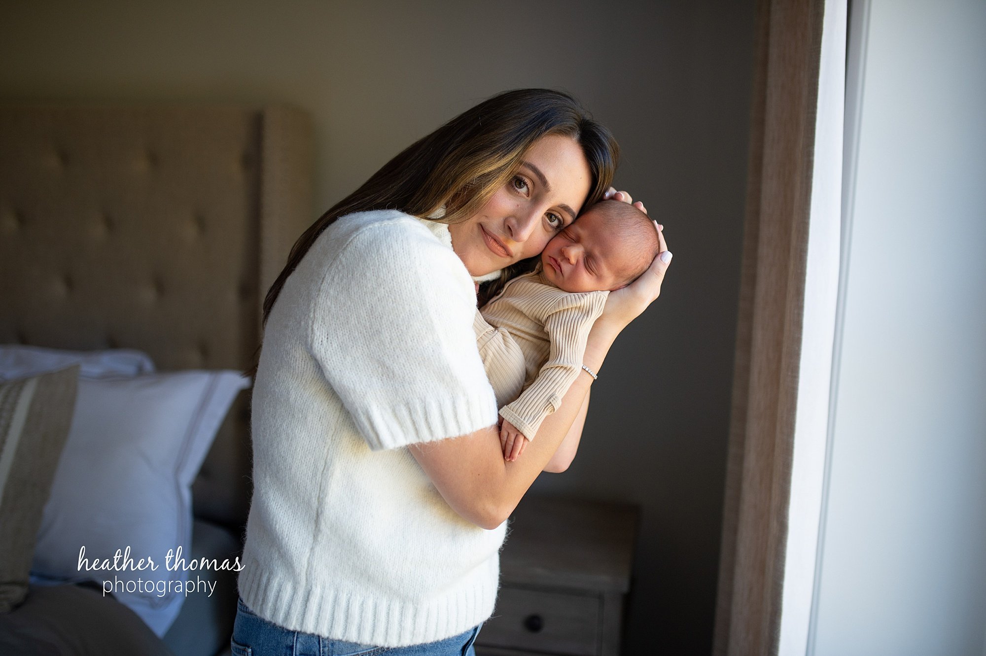 philadelphia-newborn-photogrpaher-heather-thomas-photography--02 a family holding a newborn boy during an in home lifestyle newborn photo session with heather thomas photography