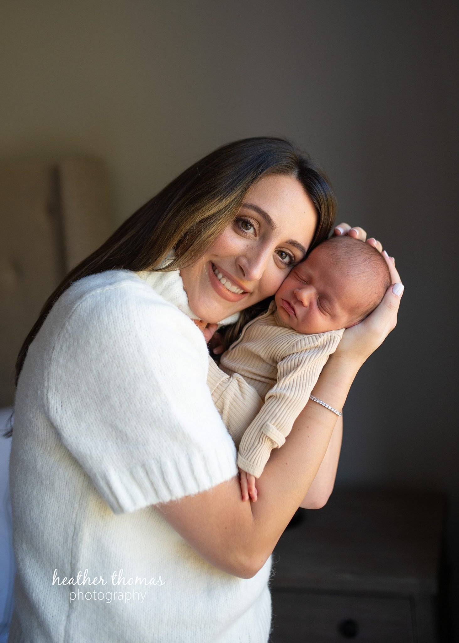 philadelphia-newborn-photogrpaher-heather-thomas-photography--02 a family holding a newborn boy during an in home lifestyle newborn photo session with heather thomas photography