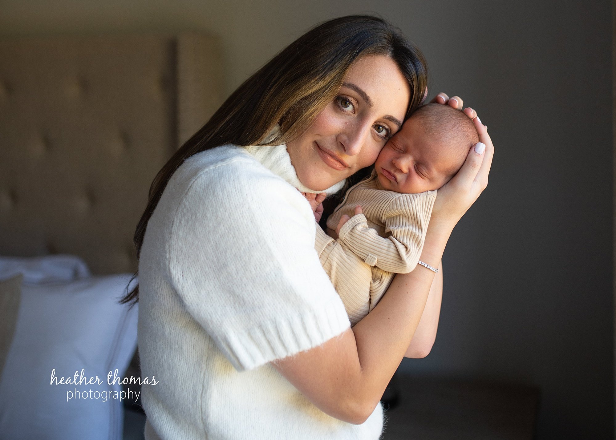 philadelphia-newborn-photogrpaher-heather-thomas-photography--02 a family holding a newborn boy during an in home lifestyle newborn photo session with heather thomas photography