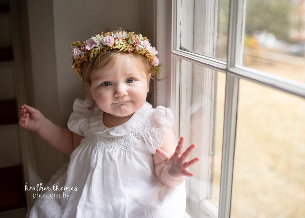5 Things To#15 Ask Before Your Cake Smash Shoot | Bucks County Family Photographer birthday girl sits by window by Heather Thomas Photography