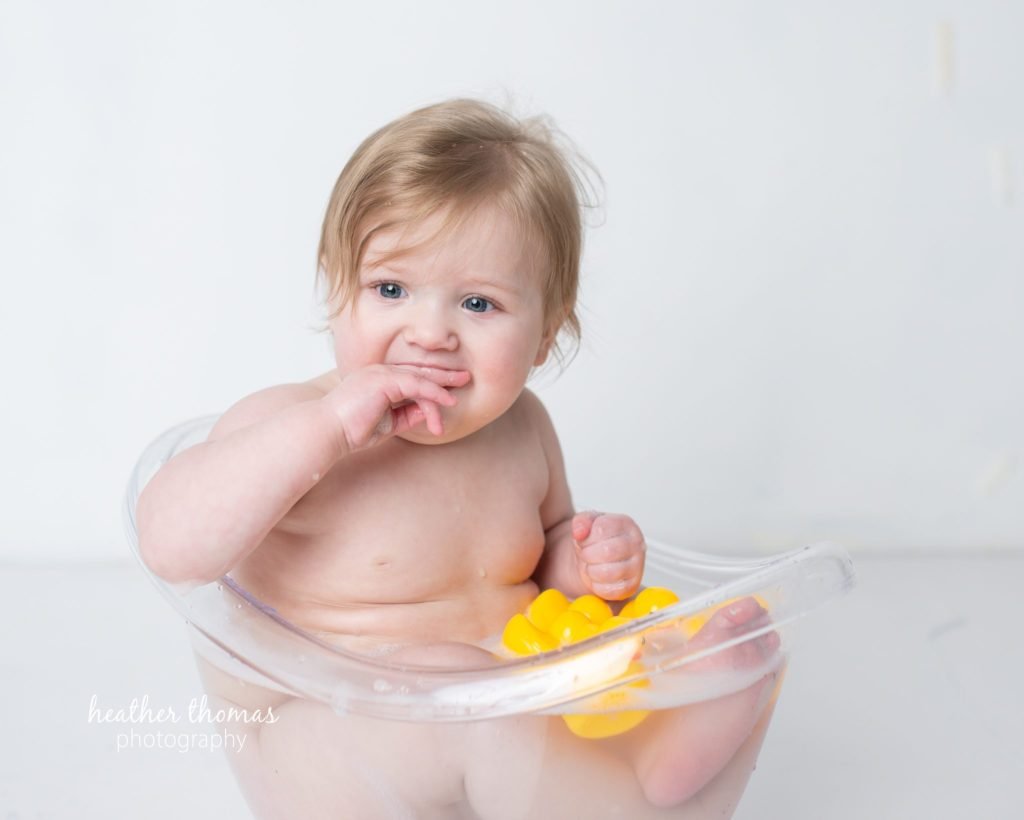 5 Things To#15 Ask Before Your Cake Smash Shoot | Bucks County Family Photographer little one in clear tub learns 5 Things To Ask Before Your Cake Smash Shoot