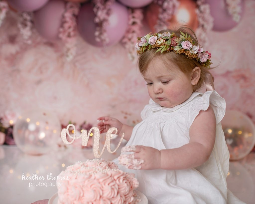 5 Things To#15 Ask Before Your Cake Smash Shoot | Bucks County Family Photographer baby in flower crown at studio after learning 5 Things To Ask Before Your Cake Smash Shoot