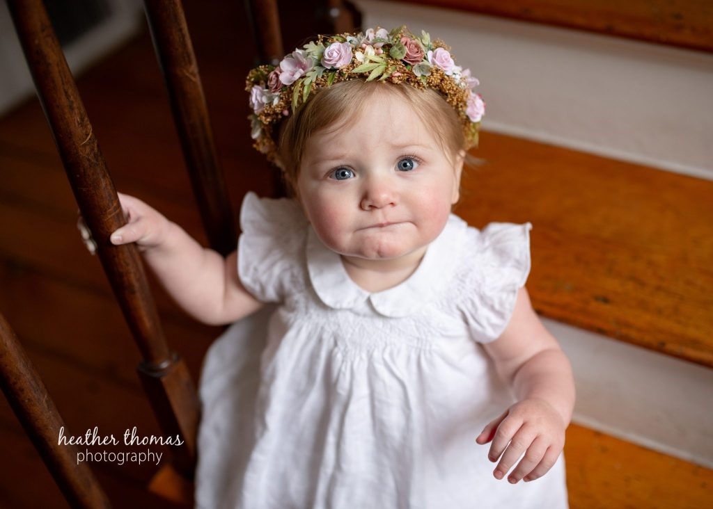 5 Things To#15 Ask Before Your Cake Smash Shoot | Bucks County Family Photographer small kid in white dress on steps by Heather Thomas Photography