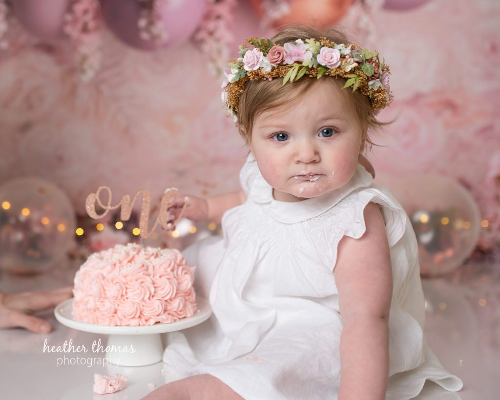 5 Things To#15 Ask Before Your Cake Smash Shoot | Bucks County Family Photographer birthday girl with floral crown and cake by Bucks County Family Photographer