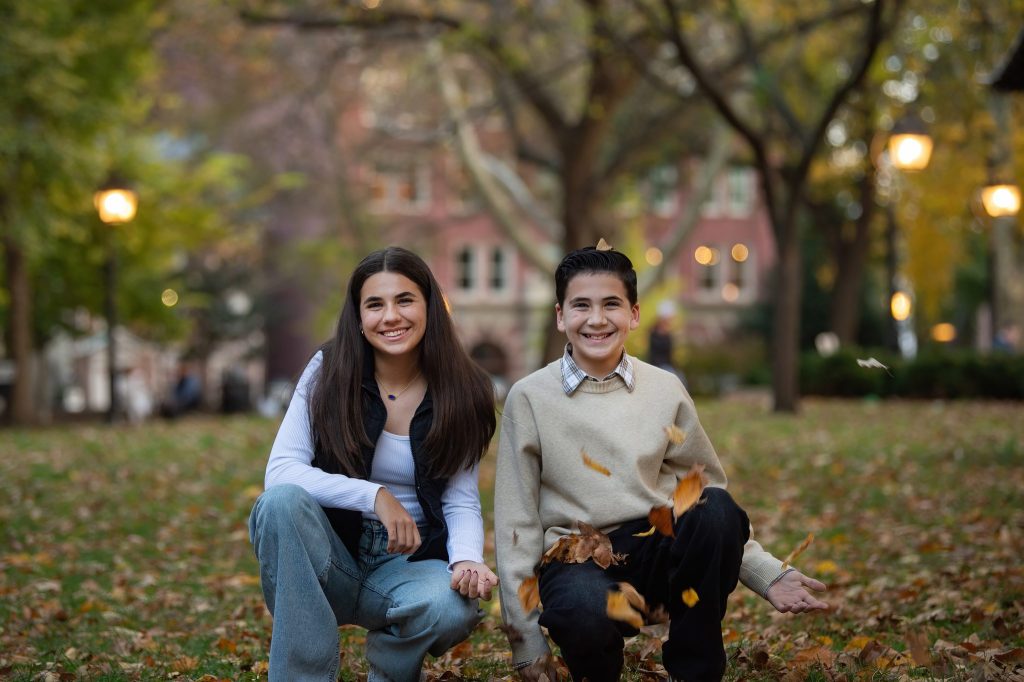 Washington Square Philadelphia Family Photography Session a boy and girl throwing leaves in washington square park philadelphia