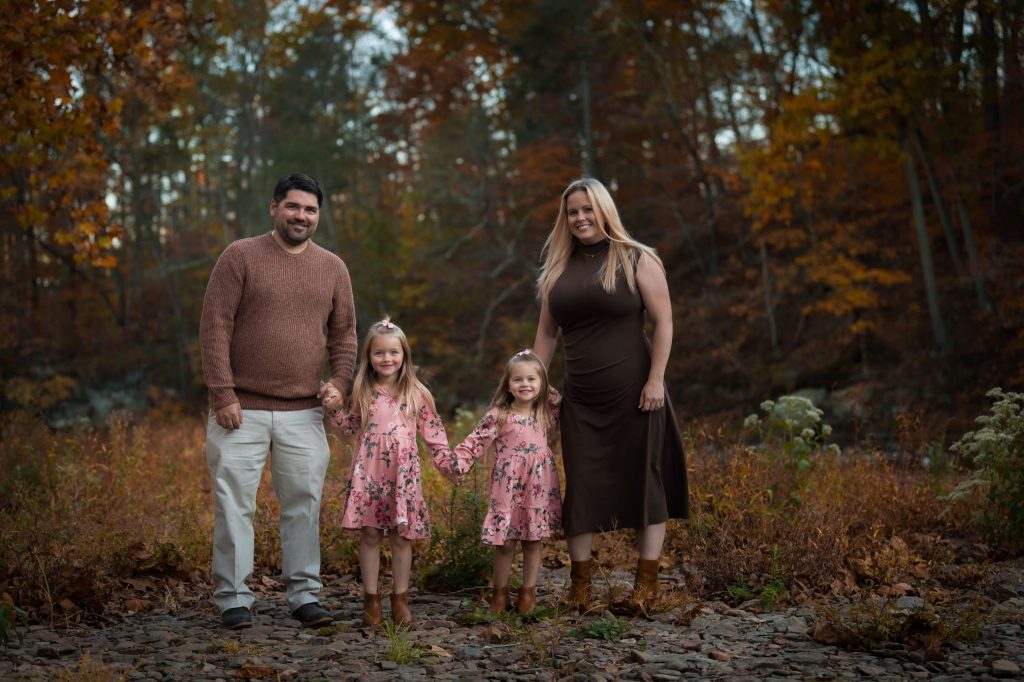 4 Reasons Why Families Choose Heather Thomas Photography as Their Bucks County Photographer a family of 4 at their outdoor fall family photo session in bucks county