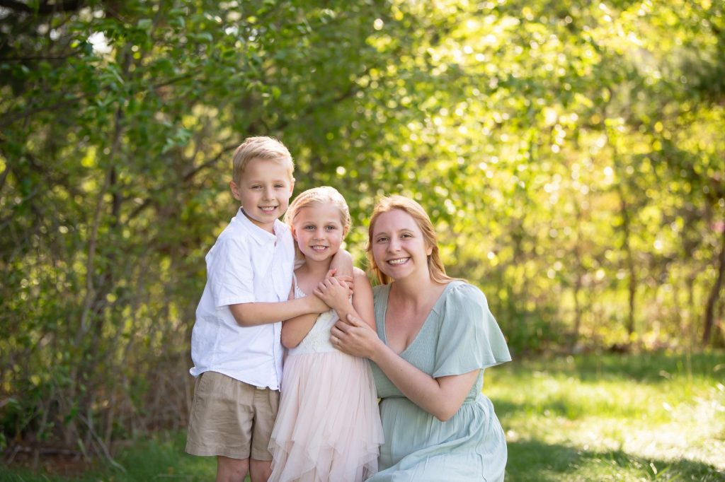 Philadelphia Easter Events: The Largest Easter Egg Hunts Near Philadelphia mother in pink dress outside with her two children posing for a maternity photography session with heather thomas