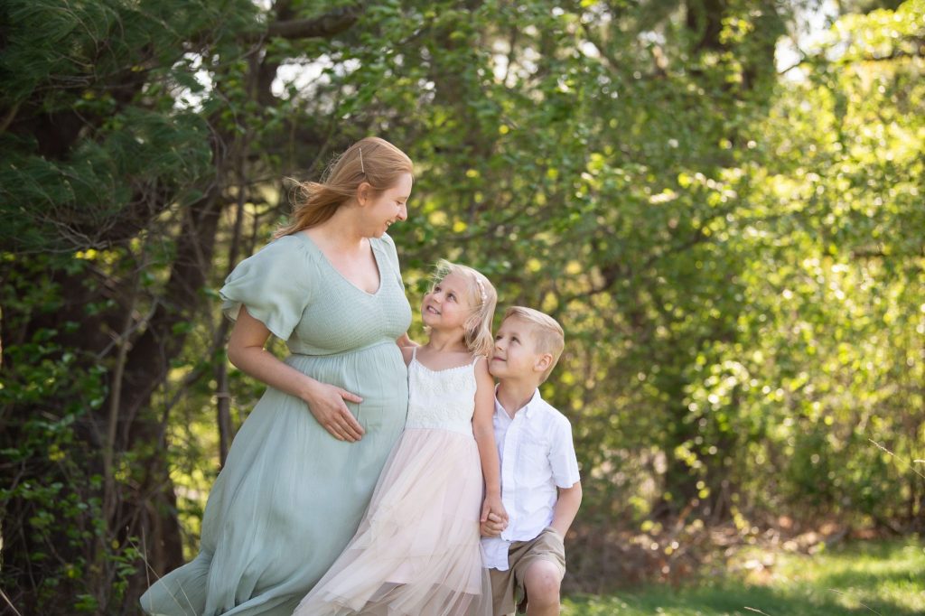 Philadelphia Maternity Photographer Recommends the 3 Best Prenatal Massages a boy and girl with their pregnant mom at a philadelphia maternity photoshoot